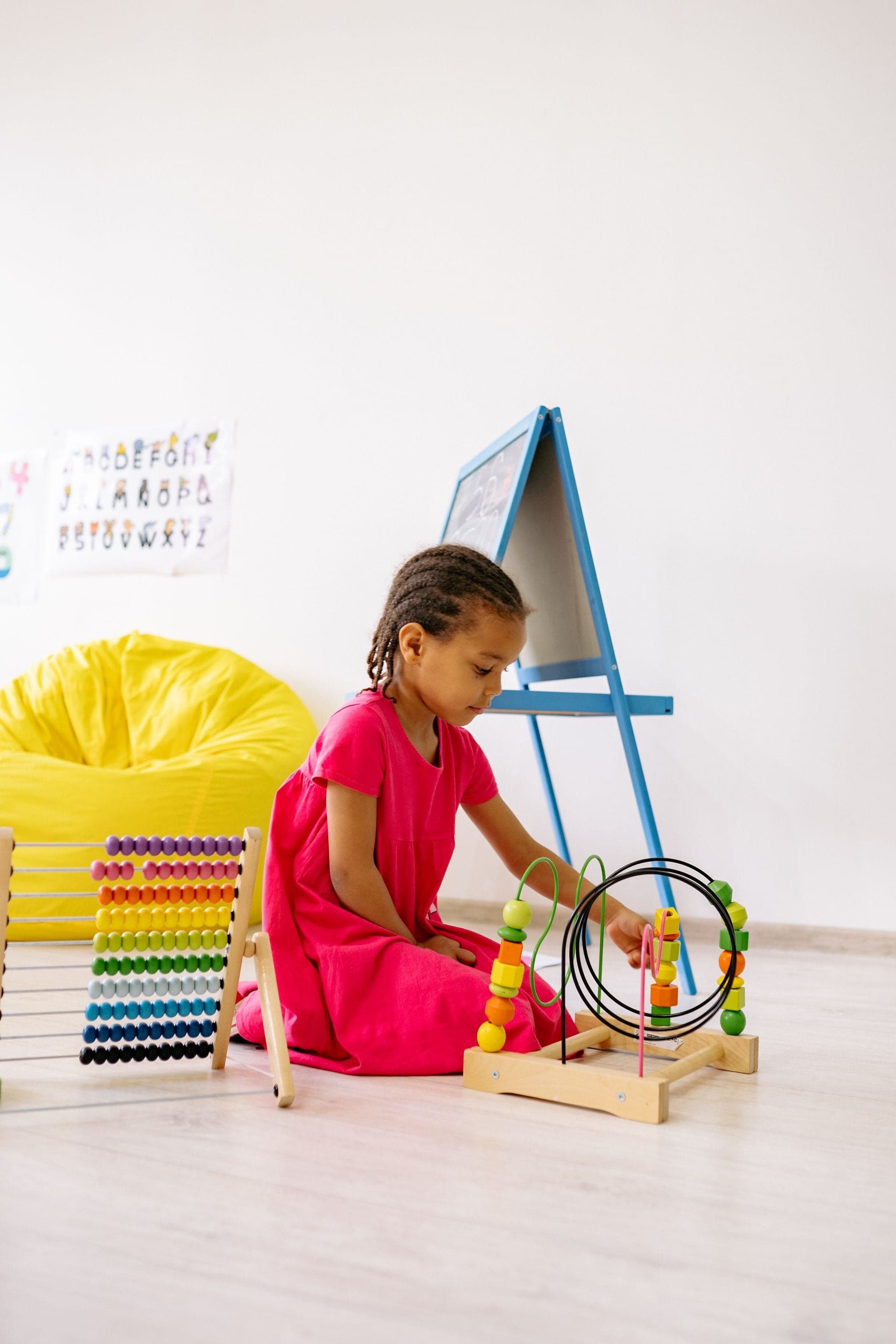 Young student learning abacus in classroom