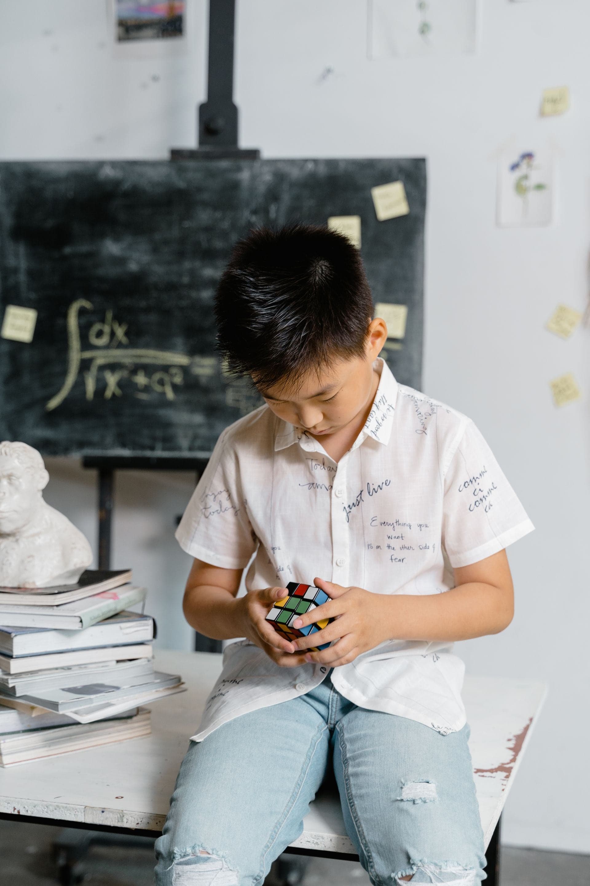 Child solving a Rubik's Cube
